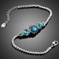 Close up detail of KHAISTA sea blue round crystal stud bracelet