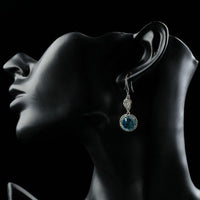 Close up of KHAISTA round sea blue crystal hook drop earrings