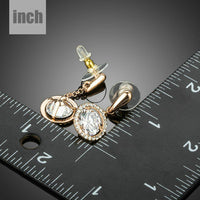 round CZ drop earrings detail view by KHAISTA