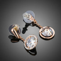 Close up of KHAISTA round CZ drop earrings