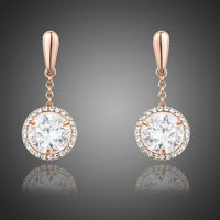 KHAISTA round CZ drop earrings on white background