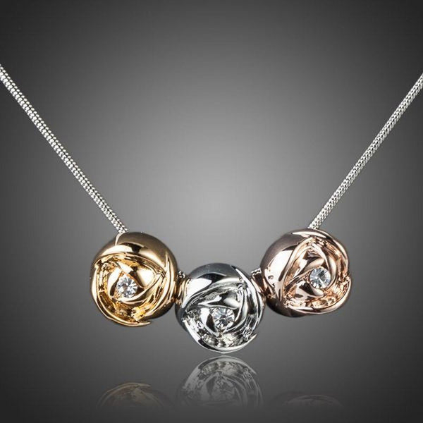 KHAISTA row of roses crystal pendant necklace on white background