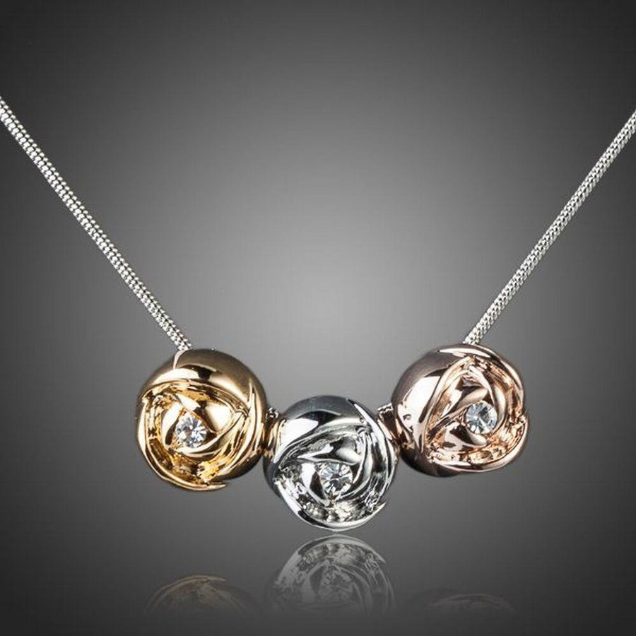 KHAISTA row of roses crystal pendant necklace on white background