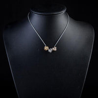Side angle view of KHAISTA row of roses crystal pendant necklace