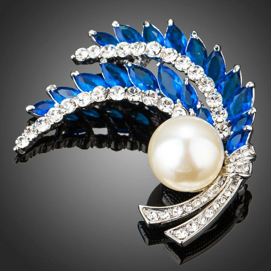 Khaista royal blue leaf rhinestone pearl brooch on white background