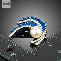 Close-up of blue stones on Khaista leaf fashion brooch