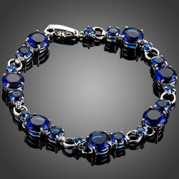 KHAISTA royal blue CZ toggle bracelet on white background