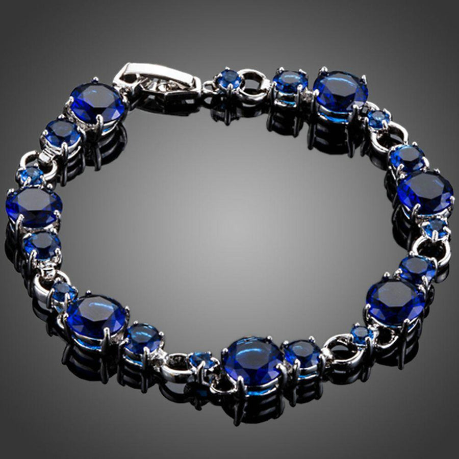 KHAISTA royal blue CZ toggle bracelet on white background