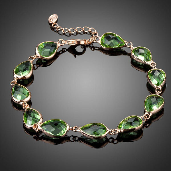 KHAISTA royal green pear cut crystal bracelet on white background