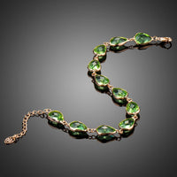 Close up detail of KHAISTA royal green pear cut crystal bracelet