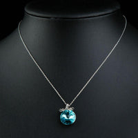 Close up detail of KHAISTA sea blue Austrian crystal necklace