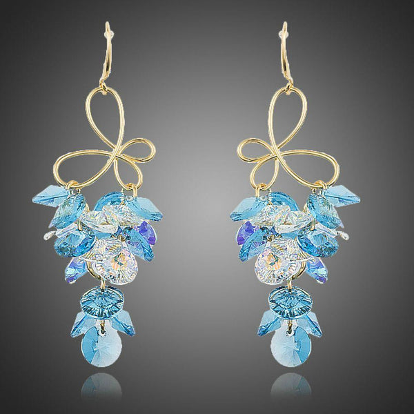 KHAISTA sea blue crystal drop earrings on white background
