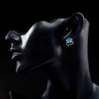 Side angle view of KHAISTA sea blue crystal flower stud earrings