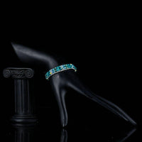 Side angle view of KHAISTA sea blue lobster clasp bracelet