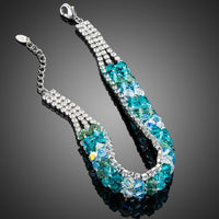 Close up detail of KHAISTA sea blue lobster clasp bracelet