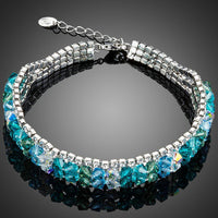 KHAISTA sea blue lobster clasp bracelet on white background