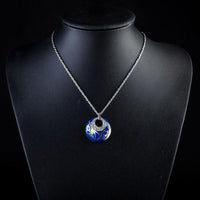 Side angle view of KHAISTA sea vibes round crystal necklace