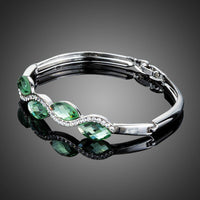 Close up detail of KHAISTA sea wave crystal bangle bracelet