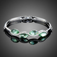 KHAISTA sea wave crystal bangle bracelet on white background