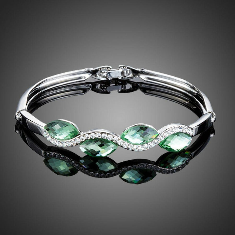 KHAISTA sea wave crystal bangle bracelet on white background