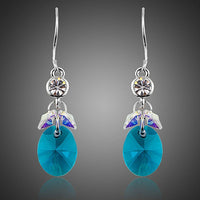KHAISTA sea blue rhinestone crystal drop earrings on white background