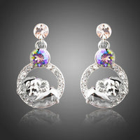 KHAISTA crystal sheep design dangle earrings on white background