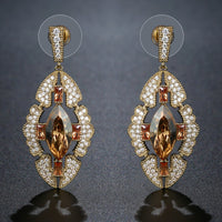 Close up of KHAISTA Austrian crystal shield dangle earrings