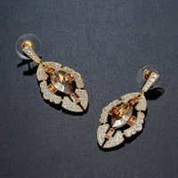 Austrian crystal shield dangle earrings detail view by KHAISTA
