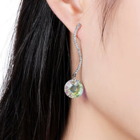 shiny arc long dangle drop earrings detail view by KHAISTA