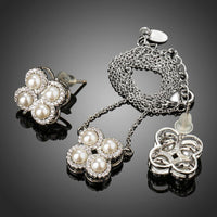 Side angle view of Khaista silver clover set