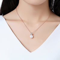 Close up detail of KHAISTA simulated pearl dazzling pendant necklace