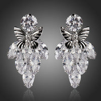 KHAISTA sitting butterfly crystal drop earrings on white background