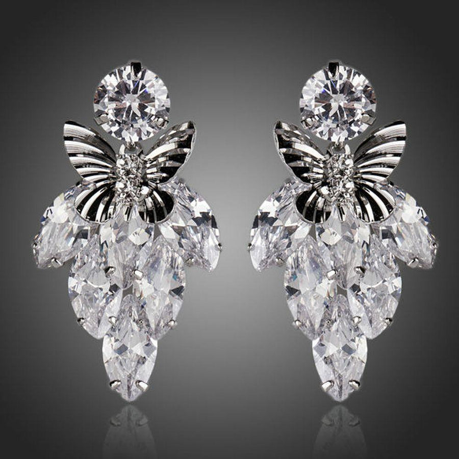 KHAISTA sitting butterfly crystal drop earrings on white background