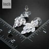 sitting butterfly crystal drop earrings detail view by KHAISTA