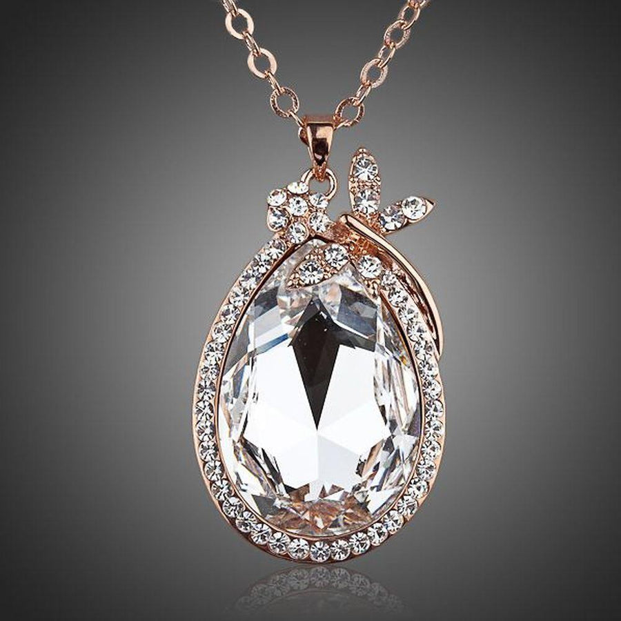 KHAISTA butterfly on large crystal pendant necklace on white background
