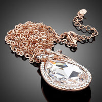 Close up detail of KHAISTA butterfly on large crystal pendant necklace