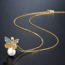Load image into Gallery viewer, Sitting Golden Butterfly On Snow Pearl Necklace Pendant - KHAISTA Fashion Jewellery
