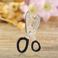 Close-up of crystals on Khaista scissors brooch
