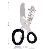 Side view of Khaista crystal scissors brooch