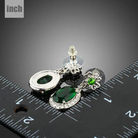 space green oval CZ drop earrings detail view by KHAISTA