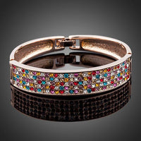 KHAISTA sparkling crystal cuff bangle on white background