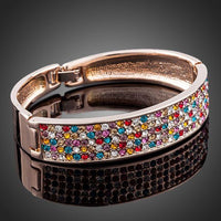 Close up detail of KHAISTA sparkling crystal cuff bangle