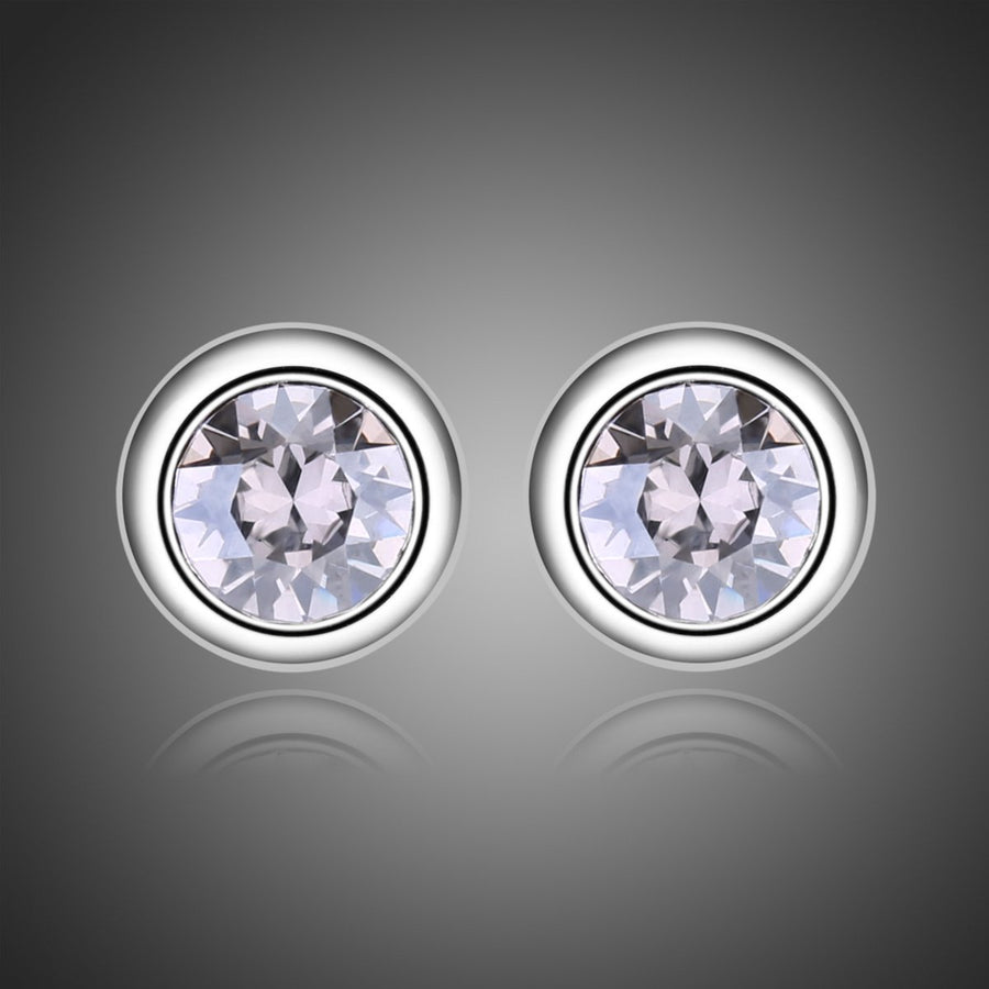 KHAISTA sparkling round crystal stud earrings on white background