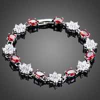 KHAISTA sparkling floral design bracelet on white background