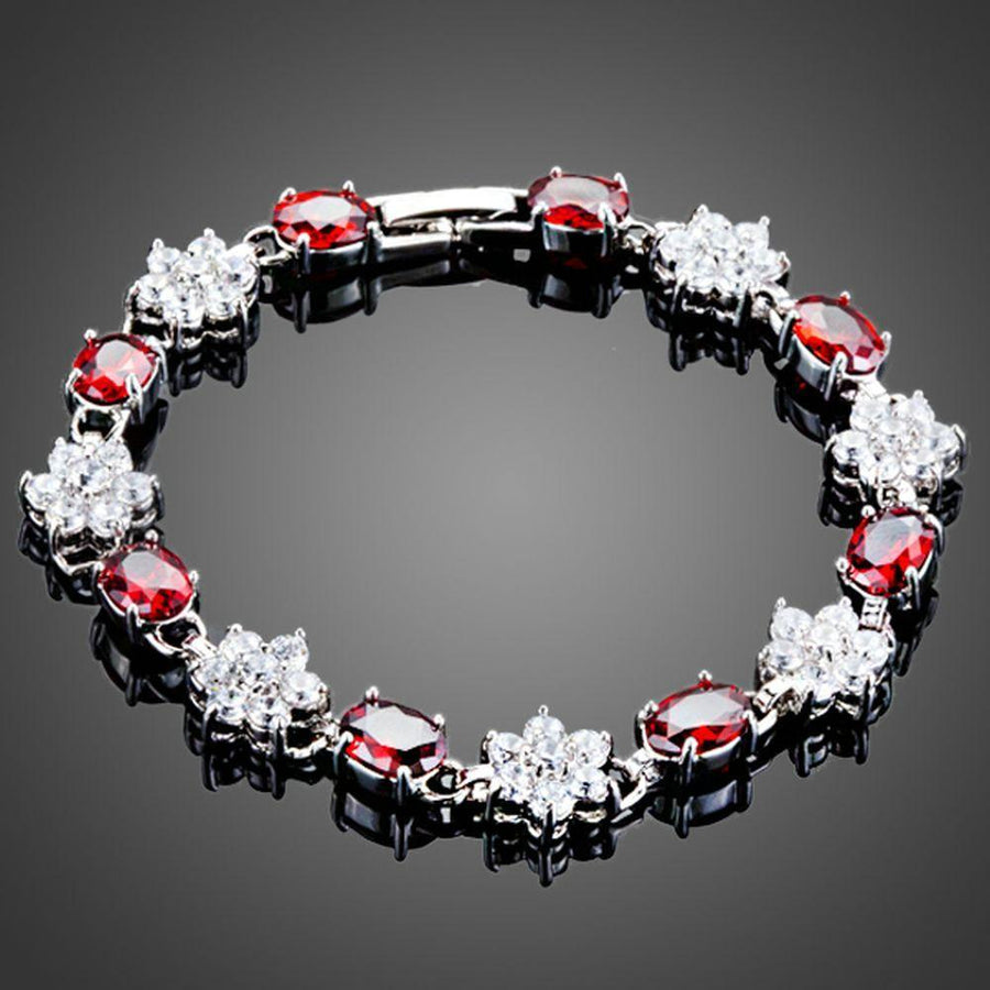 KHAISTA sparkling floral design bracelet on white background