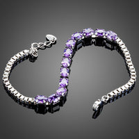 Close up detail of KHAISTA purple crystal lobster bracelet