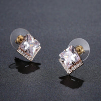 square cut CZ stud earrings detail view by KHAISTA