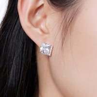 Close up of KHAISTA square cut CZ stud earrings