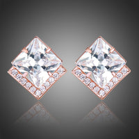 KHAISTA square cut CZ stud earrings on white background