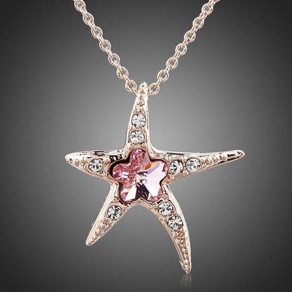 KHAISTA crystal starfish pendant necklace on white background